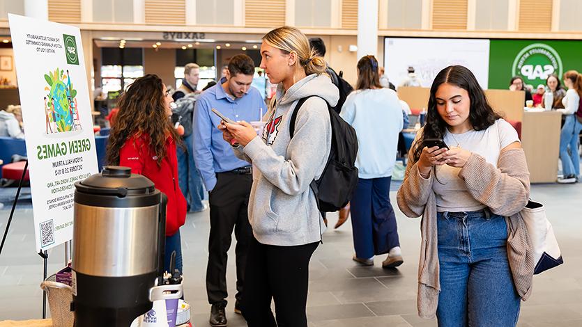 Marist students taking the SAPC survey in the Dyson Center Atrium.