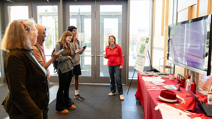 SAPC member Beth Veasey (left) and students during the Green Games, testing their knowledge of sustainable practices.