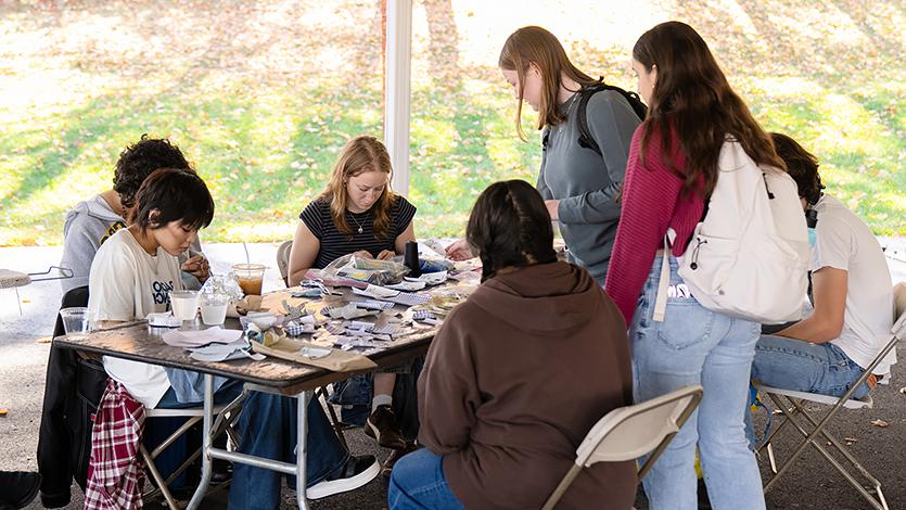 Students working at the Repair Cafe at the SEED Sustainability Fair alongside other environmentally focused groups. 